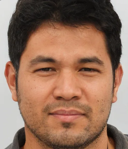 Man with dark hair and ears